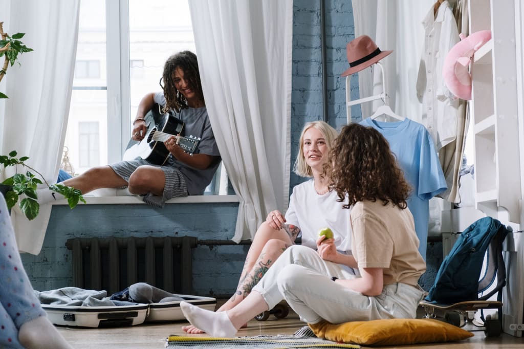 Group of friends unpacking and settling into a rental apartment
