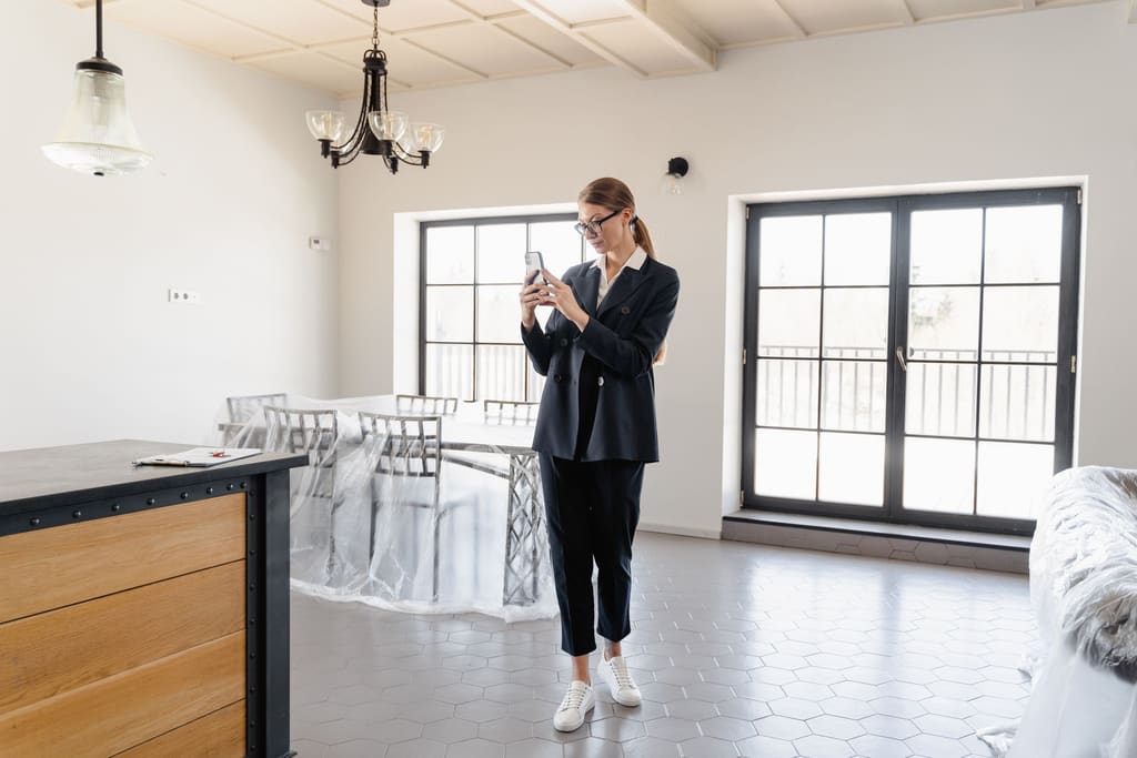 Photographer shooting the interior of a bright, modern apartment